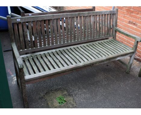 A large teak garden bench