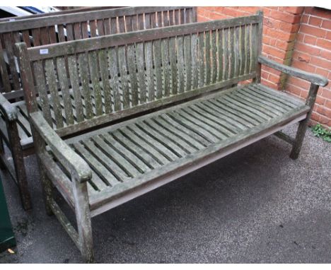 A large teak garden bench