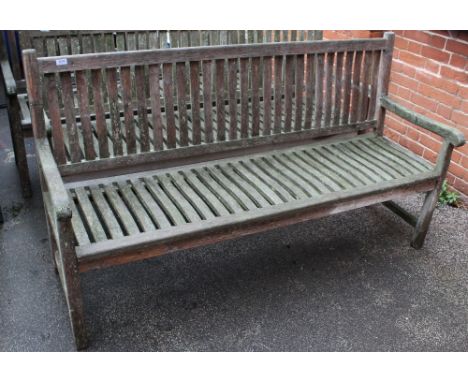 A large teak garden bench