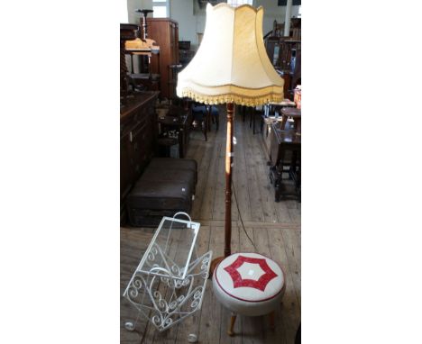 A painted metal and glass magazine rack, a leatherette footstool and a standard lamp