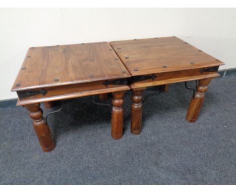 A pair of sheesham wood lamp tables.