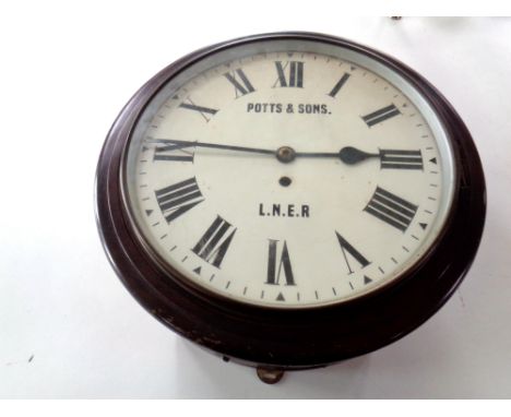 An early 20th century circular station wall timepiece with enamel dial, signed Potts &amp; Sons LNER, with chain driven singl