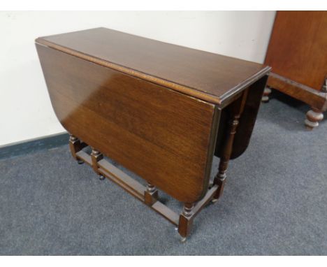 A 20th century oak gate leg table.