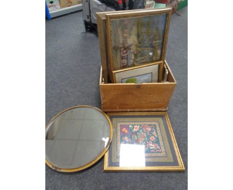 An antique pine box containing assorted pictures, a circular framed bevel edged mirror, a Japanese silk work panel, a tapestr