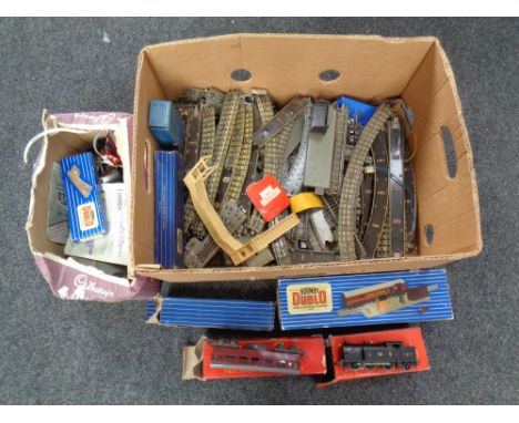 A box containing Hornby railways rolling stock, track and accessories including a 6917 LMS engine.