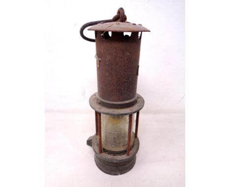 A vintage Wolf miner's lamp.