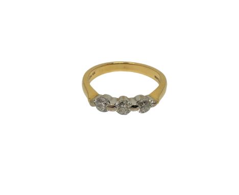 An 18ct gold three stone diamond ring, size K1/2 CONDITION REPORT: 3.3g