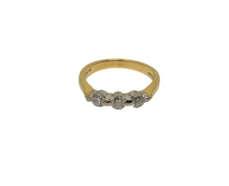 An 18ct gold three stone diamond ring, size K1/2 CONDITION REPORT: 3.3g