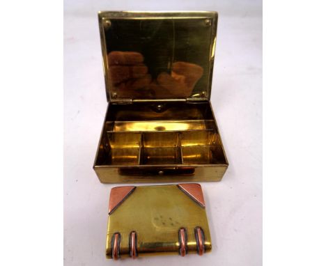 A vintage brass Gesch German stamp box together with a further brass and copper lighter in the form of a book (AF).