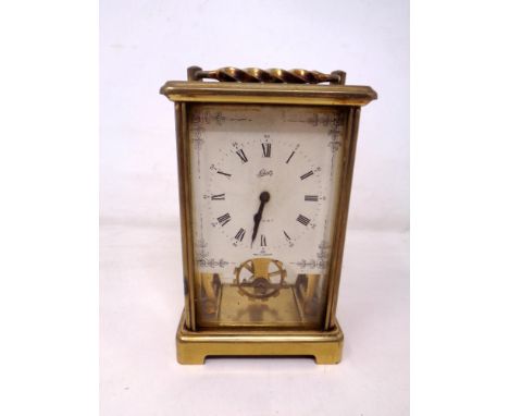 A brass cased German 12 jewel carriage clock by Schatz.