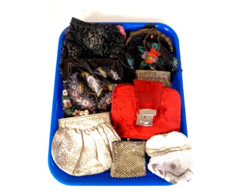 A tray containing a collection of vintage purses including beaded examples.