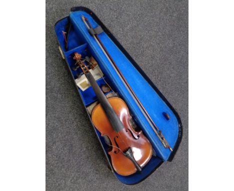 An Antonius Stradivarius copy violin and bow in case 