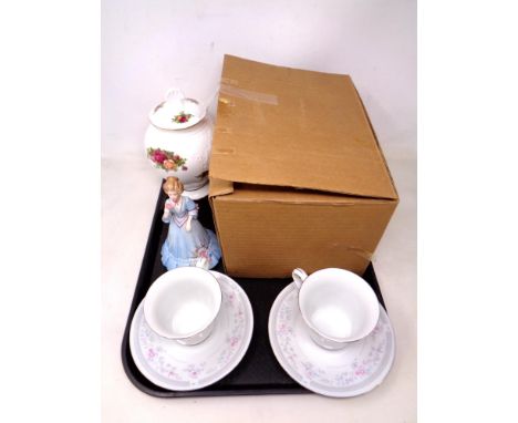 A tray containing Royal Albert Old Country Roses lidded pot, a figurine together with a boxed Chinese Pagoda tea service.