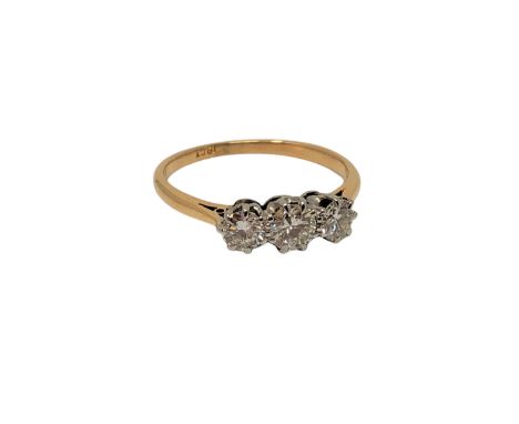 An 18ct gold three stone diamond ring, size M CONDITION REPORT: 2.4g