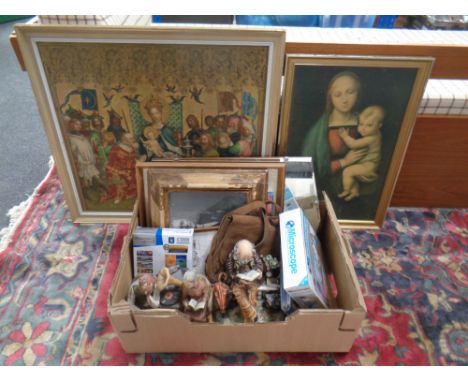 A box containing a frameless mirror, assorted pictures, religious prints together with two continental ornaments.
