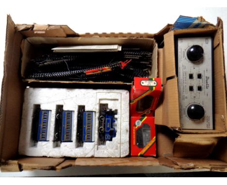 A box containing a 7178 engine with coaches, two Hornby railways 00 gauge coaches (boxed), a Duette twin supply power unit to