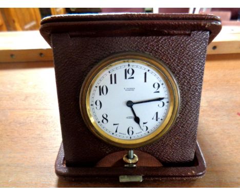 Early twentieth century leather cased travelling alarm clock.