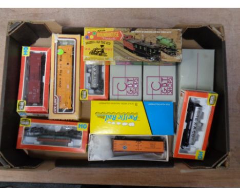 A box containing Roundhouse Lifelike trains and Heritage collection rolling stock, various scales (boxed).