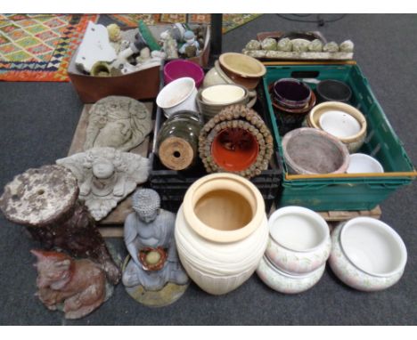 A pallet containing a large quantity of assorted plant pots, stoneware trough, garden figures, bird bath etc.