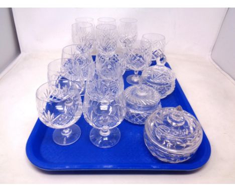 A tray containing assorted lead crystal drinking glasses together with three further cut glass lidded pots.