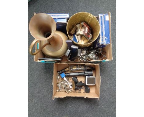 Two boxes containing a Satnav, a kukri knife in sheath, collectors plates, jewellery boxes, Tiffany style lamp, brass ware et