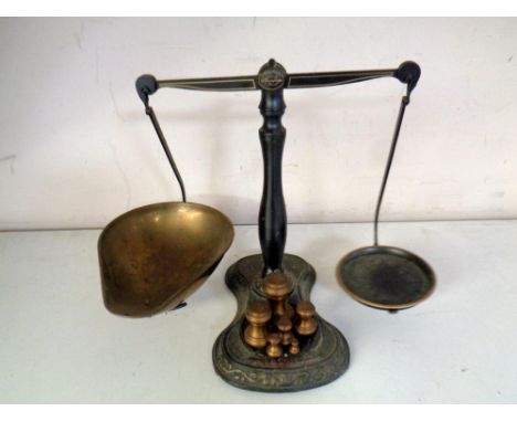 A set of vintage Salter balance scales with weights.