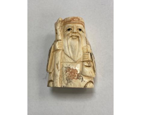 A carved bone Chinese netsuke  - village elder with staff