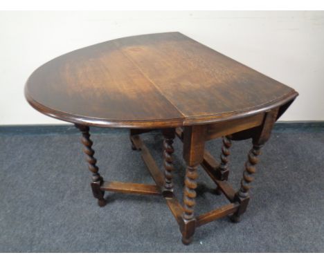 A 20th century oak barley twist gate leg table.