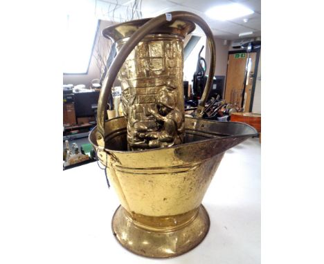 A brass coal bucket and a brass stick stand