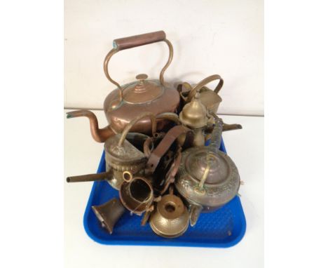 A tray containing antique and later copper and brass ware including kettles, eastern teapots, watering can, doorbell etc.