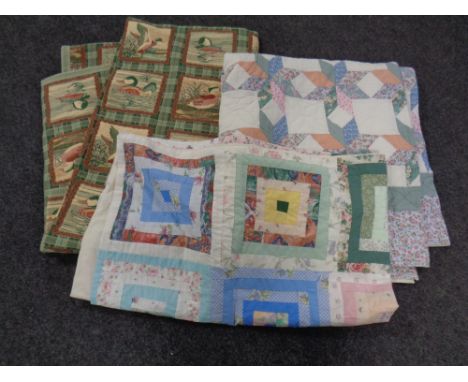A patchwork throw together with a further hand stitched quilt and a tapestry quilt depicting ducks.