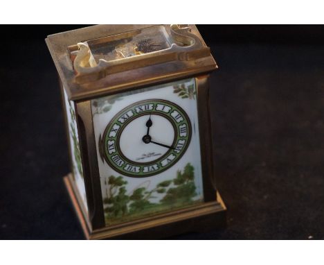 An English brass cased carriage timepiece With a 6cm porcelain dial signed The Chester Carriage Clock Company with Roman nume