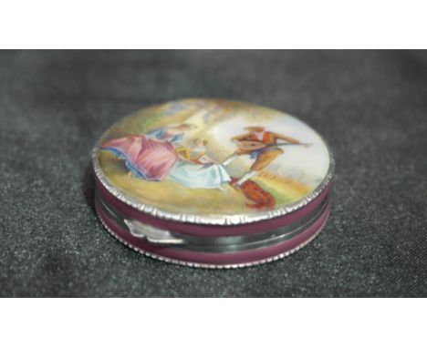 A Continental 935 silver pill box, the silver engine turned box with pink enamel to the sides, and enamelled scene to the top