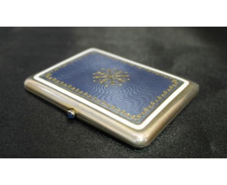 A silver, gilt and lilac enamel cigarette case by Contreau, the engine turned tops enamelled and gilded with cabochon button