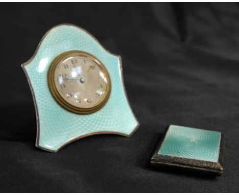 An Edwardian silver clock and vesta case with blue enamelled engine turned design