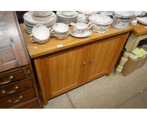 A modern light oak veneered sideboard 