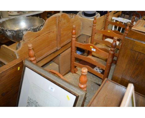 A set of four pine and rush seated ladder back chairs