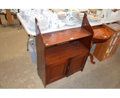 A mahogany wall cupboard fitted shelf above 