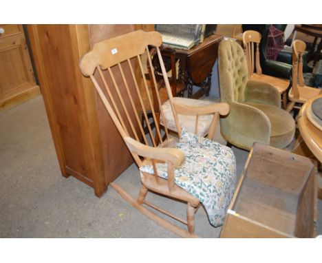 A stick back rocking chair 