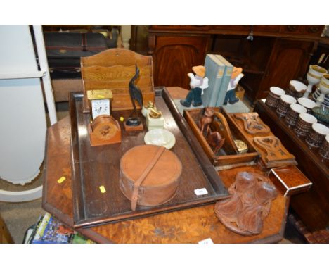 A large oak tray together with two sliding book racks; a pair of book ends; stationery rack; brass cased carriage clock and o