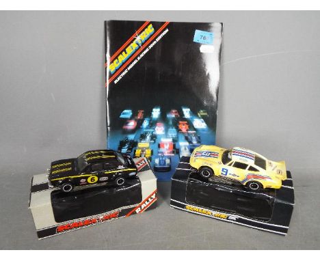 Scalextric - Two boxed vintage Scalextric cars with a 20th Edition Scalextric catalogue. Lot includes Scalextric C125 Porsche