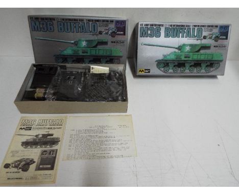 Mitsuwa Model - 2 boxed unmade 1:48 scale motorised remote control M36 Buffalo tanks. Both are in open boxes with most of the