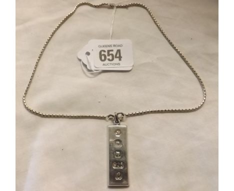 A SILVER NECK CHAIN WITH INGOT 