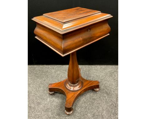 A William IV mahogany ogee sarcophagus teapoy, hinged cover enclosing a fitted interior, panelled baluster pillar, incurved b