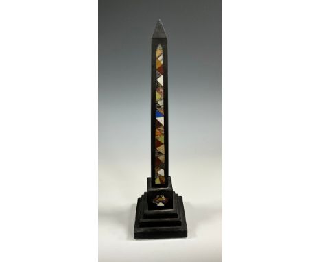 A granite and pietra dura obelisk, the facade inlaid with onyx, marble, red jasper and other specimen stones, stepped square 