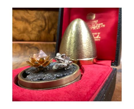Stuart Devlin (1931-2018) - an Elizabeth II silver gilt surprise Easter egg, enclosing a Frog on lily pads, numbered 205, 7cm
