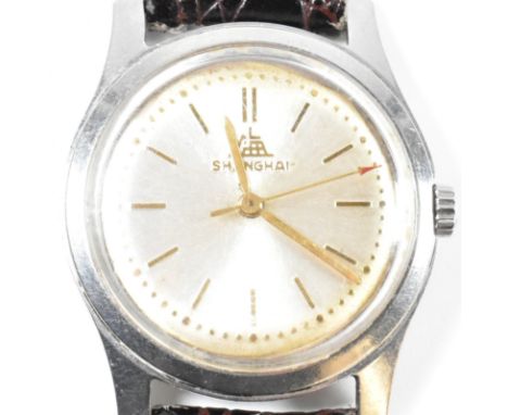 A vintage Shanghai wristwatch. The Shanghai wristwatch having stick indices and sword hands to leather straps. Signed Shangha