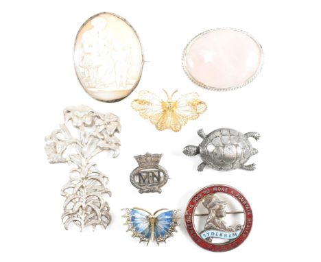 A collection of silver and white metal brooch pins. The lot to include a silver flower brooch pin, marked silver to verso. A 