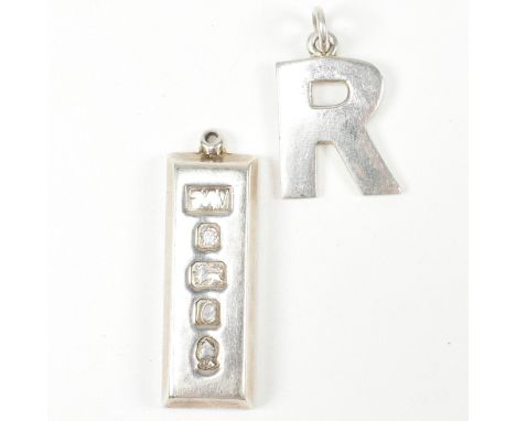 A hallmarked silver ingot pendant and initial necklace pendant. The pendants to include a hallmarked silver ingot necklace pe
