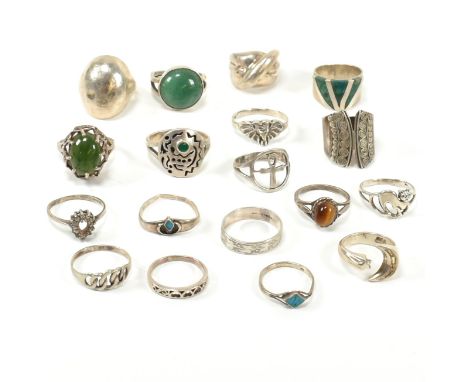 A collection of silver and gem set rings. The 18 rings to include silver band rings, tiger's eye, green hard stone set rings,